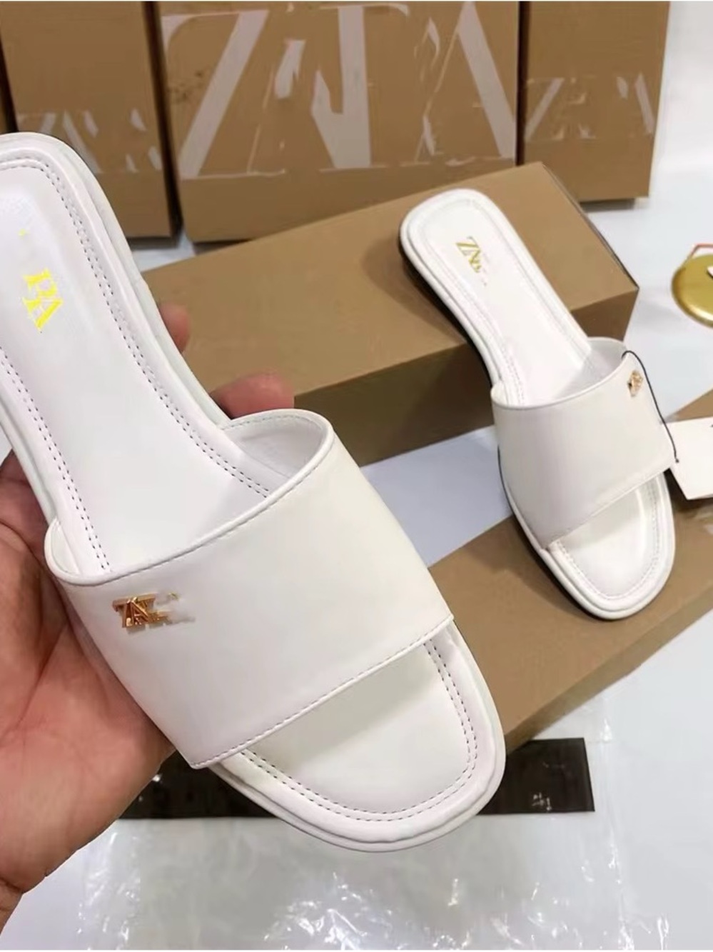 Zara White Slide Sandals with Gold Logo Pin